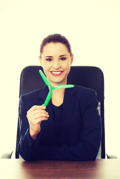 Green energy concept. Woman with windmill — Stock Photo, Image