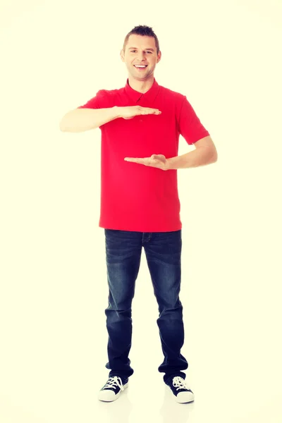 Excited man showing copy space — Stock Photo, Image