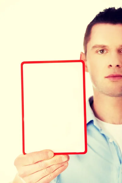 Happy man showing and displaying placard — Stock Photo, Image