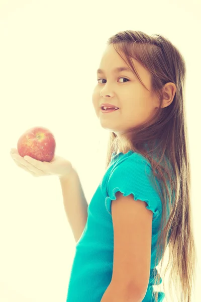 Girl holding an apple — Stock Photo, Image