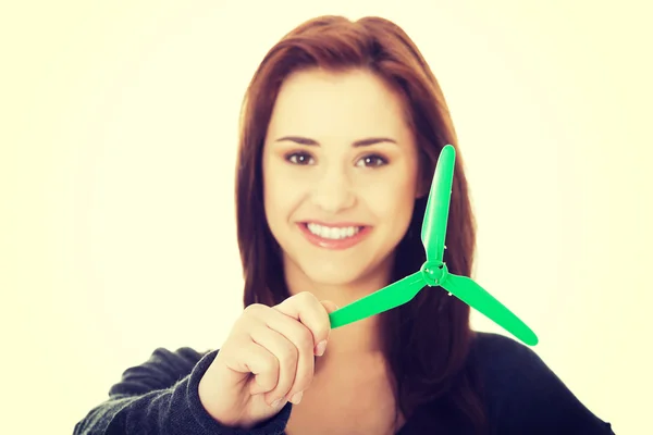 Green energy concept. Woman with windmill — Stock Photo, Image