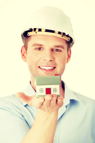 A forewoman holding a model house — Stock Photo, Image