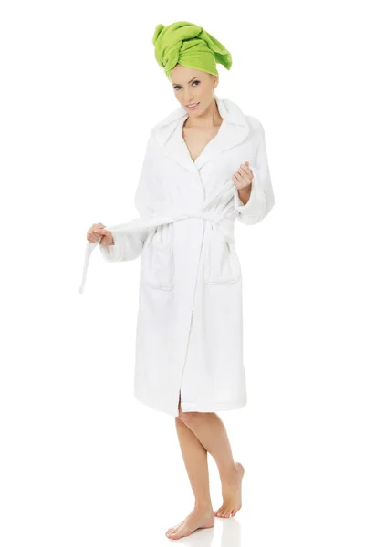 Woman in bathrobe and turban. — Stock Photo, Image