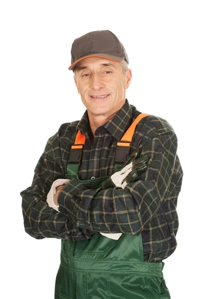 Mature gardener standing with folded arms — Stock Photo, Image