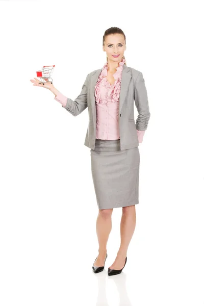 Businesswoman with shopping cart. — Stock Photo, Image