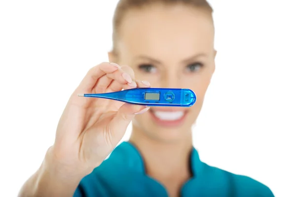 Attractive doctor with a thermometer. — Stock Photo, Image