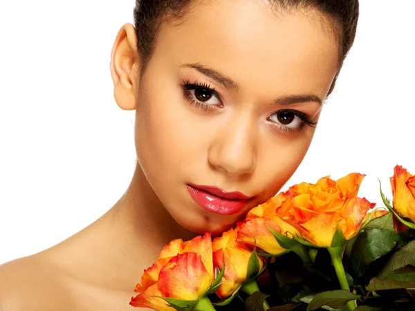 African woman with roses. — Stock Photo, Image
