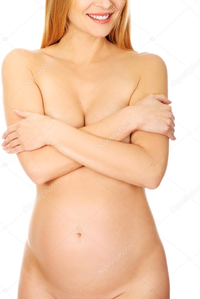 Pregnant woman covering her breast