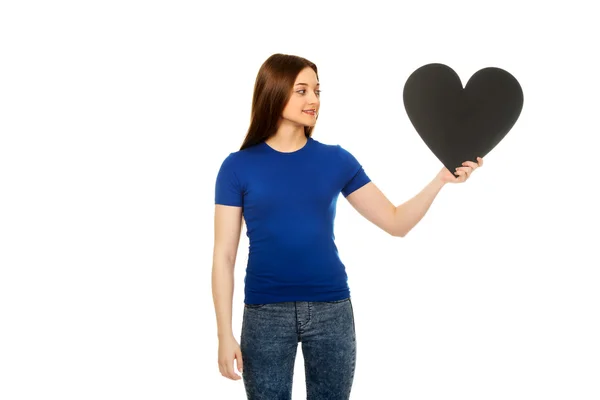 Happy teenager holding paper heart. — Stock Photo, Image