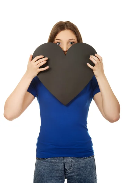 Happy teenager holding paper heart. — Stock Photo, Image