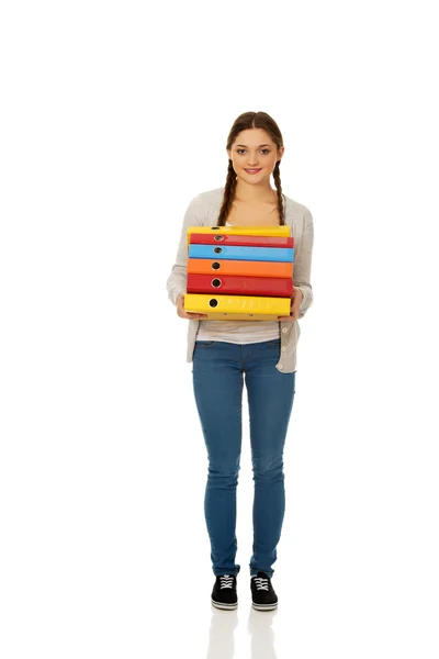 Teen woman holding binders. — Stock Photo, Image