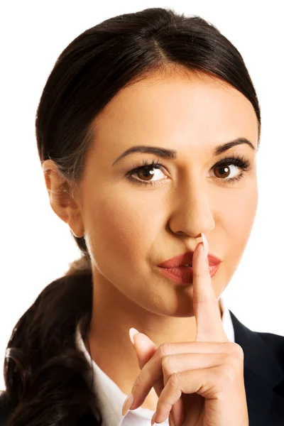 Businesswoman making silent sign — Stock Photo, Image