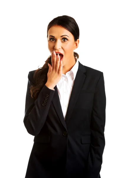 Businesswoman covering her mouth — Stock Photo, Image