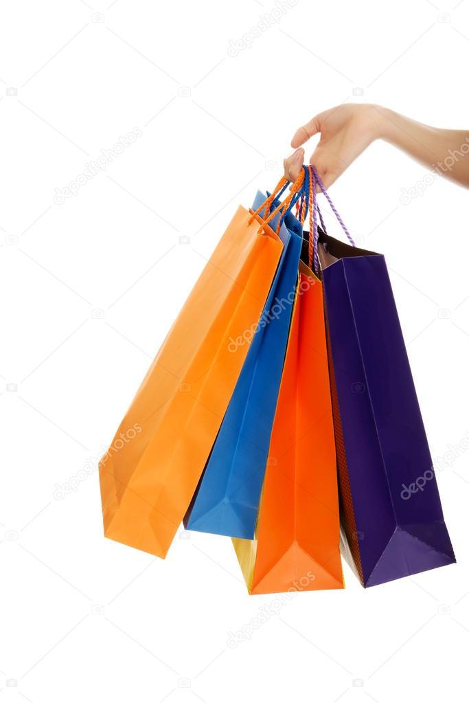 Woman's hand with shopping bags.