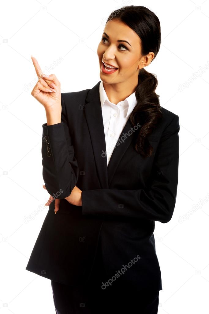 Businesswoman pointing at copyspace