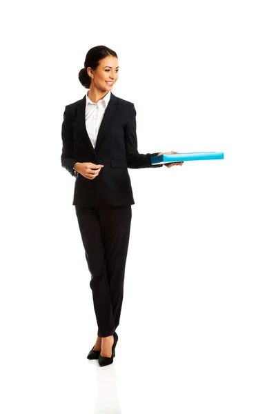 Businesswoman giving a binder — Stock Photo, Image