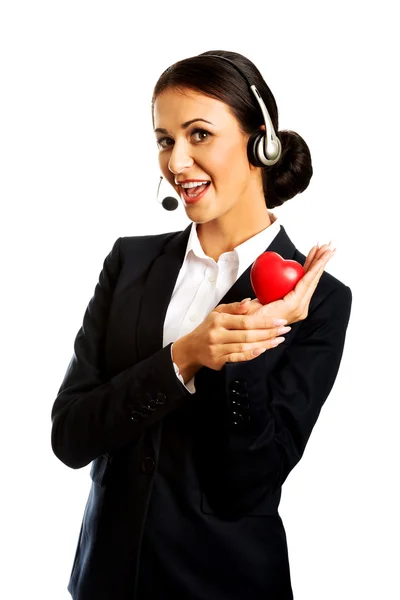 Call center woman holding heart model — Stock Photo, Image