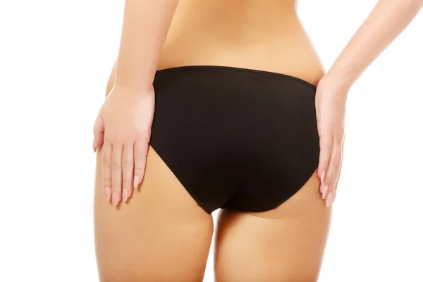 여자 그녀의 엉덩이 만져. — 스톡 사진