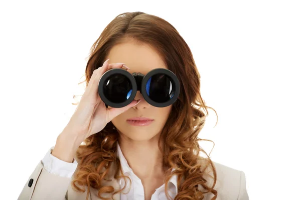 Businesswoman looking through binoculars. — Stock Photo, Image