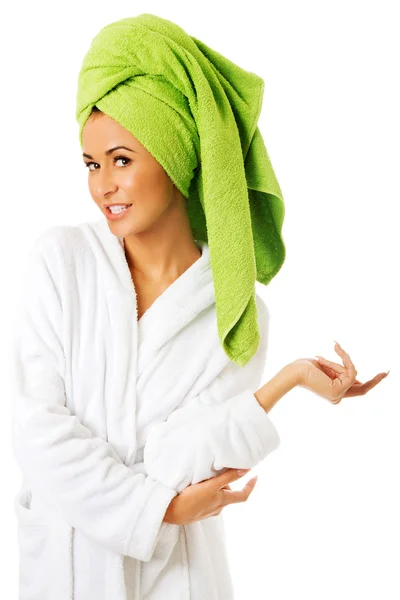 Woman in bathrobe looking at camera — Stock Photo, Image