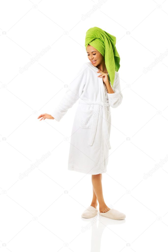 Woman standing in bathrobe