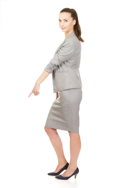 Businesswoman pointing down. — Stock Photo, Image