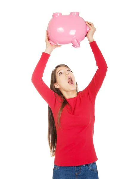 Young woman with piggybank. — Stock Photo, Image