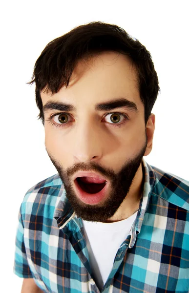 Young shocked man with mouth open. — Stock Photo, Image