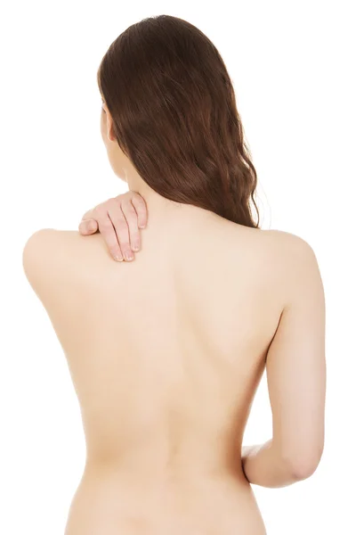 Woman holding her back. Stock Picture