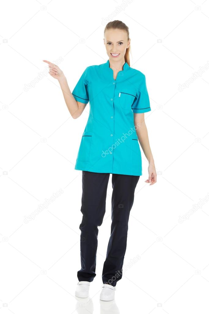 Female doctor pointing up.