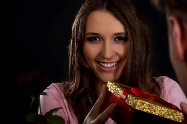 Woman receiving a gift. — Stock Photo, Image