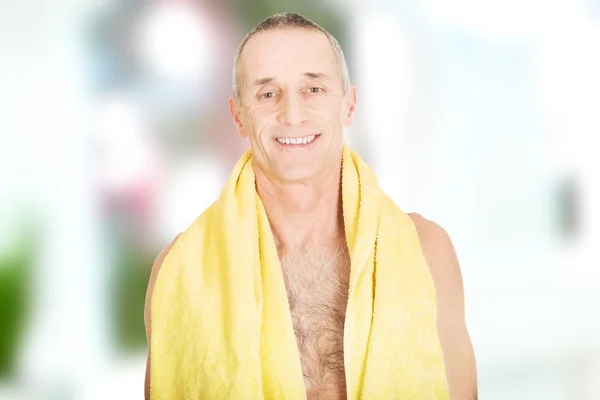 Mature man with a towel around neck — Stock Photo, Image