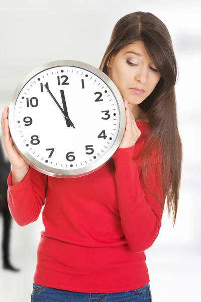 Beautiful woman with the clock. — Stock Photo, Image