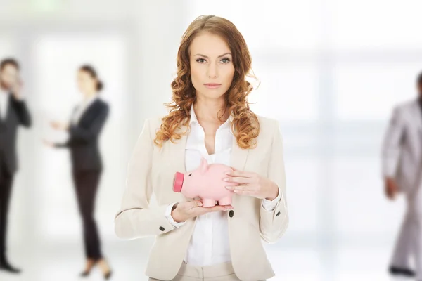 Business woman with piggybank. — Stock Photo, Image