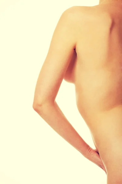 Ausgeschnittene Rückseite nackte Frau mit Hand an der Hüfte — Stockfoto