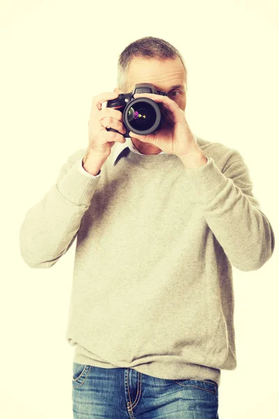 Mature man with photo camera — Stock Photo, Image