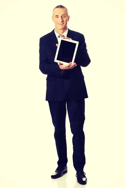 Happy businessman holding digital tablet — Stock Photo, Image