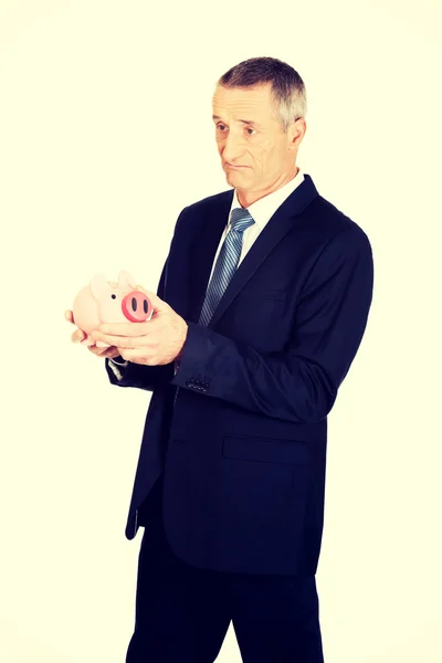 Businessman holding piggy bank — Stock Photo, Image