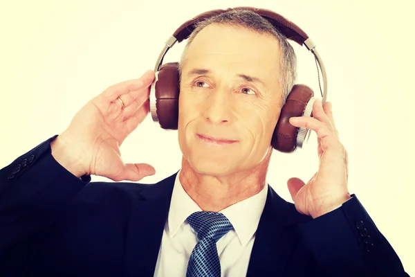 Businessman with big headphones — Stock Photo, Image