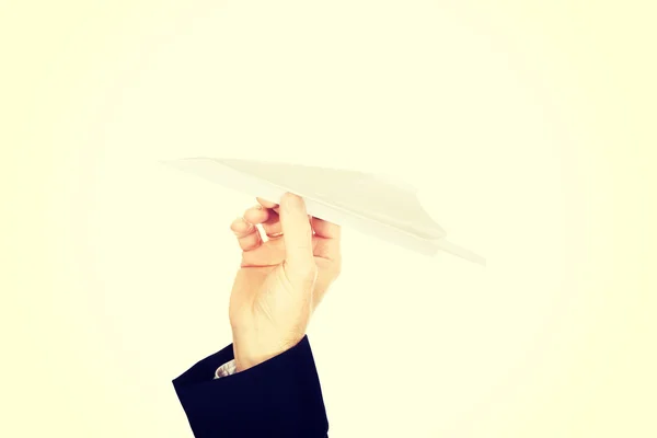 Z męskiej strony rzucanie papierowy samolot z bliska — Zdjęcie stockowe