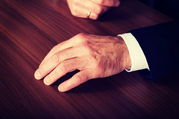 Businessmans hands put on the desk — Stock Photo, Image