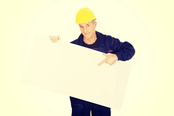 Worker presenting empty banner — Stock Photo, Image