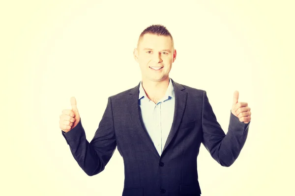 Businessman gesturing thumbs up. — Stock Photo, Image