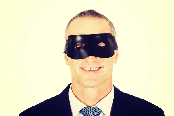 Businessman wearing eye mask — Stock Photo, Image