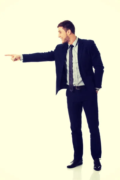 Businessman pointing by finger — Stock Photo, Image