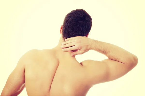 Athletic man feeling pain in his neck. — Stock Photo, Image