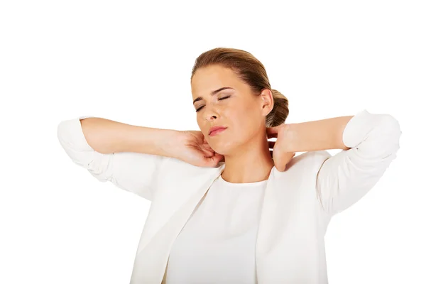 Businesswoman having huge neck pain — Stock Photo, Image