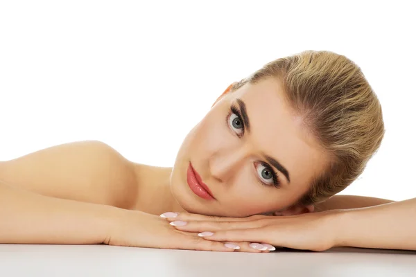 Young sad woman based on table. — Stock Photo, Image