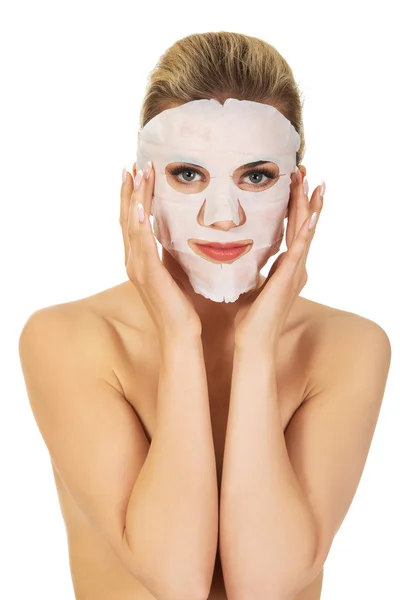 Young happy woman with facial mask. — Stock Photo, Image