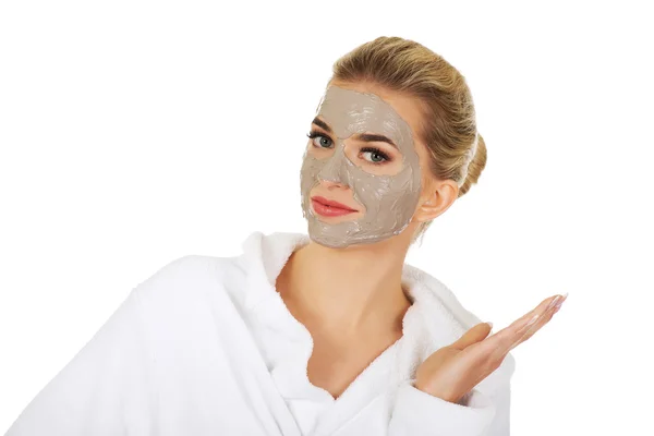 Young happy woman with facial mask. — Stock Photo, Image